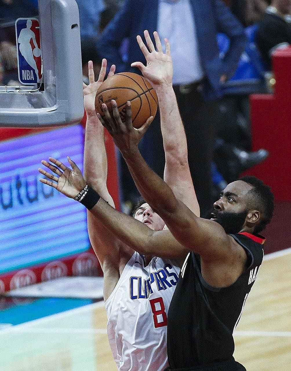 Houston Rockets star James Harden going for a basket as the LA Clippers' Danilo Gallinari blocks him in their NBA game at the Staples Centre on Wednesday.
