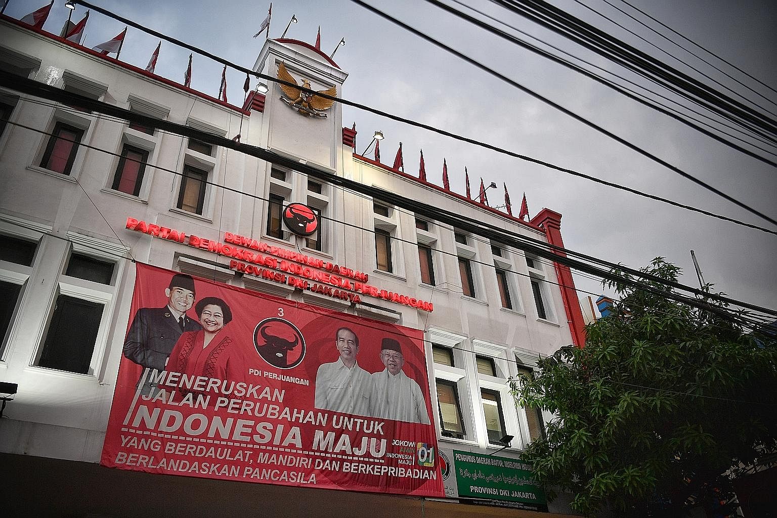 A banner of President Joko Widodo and his party at the Indonesian Democratic Party - Struggle office in South Jakarta City.