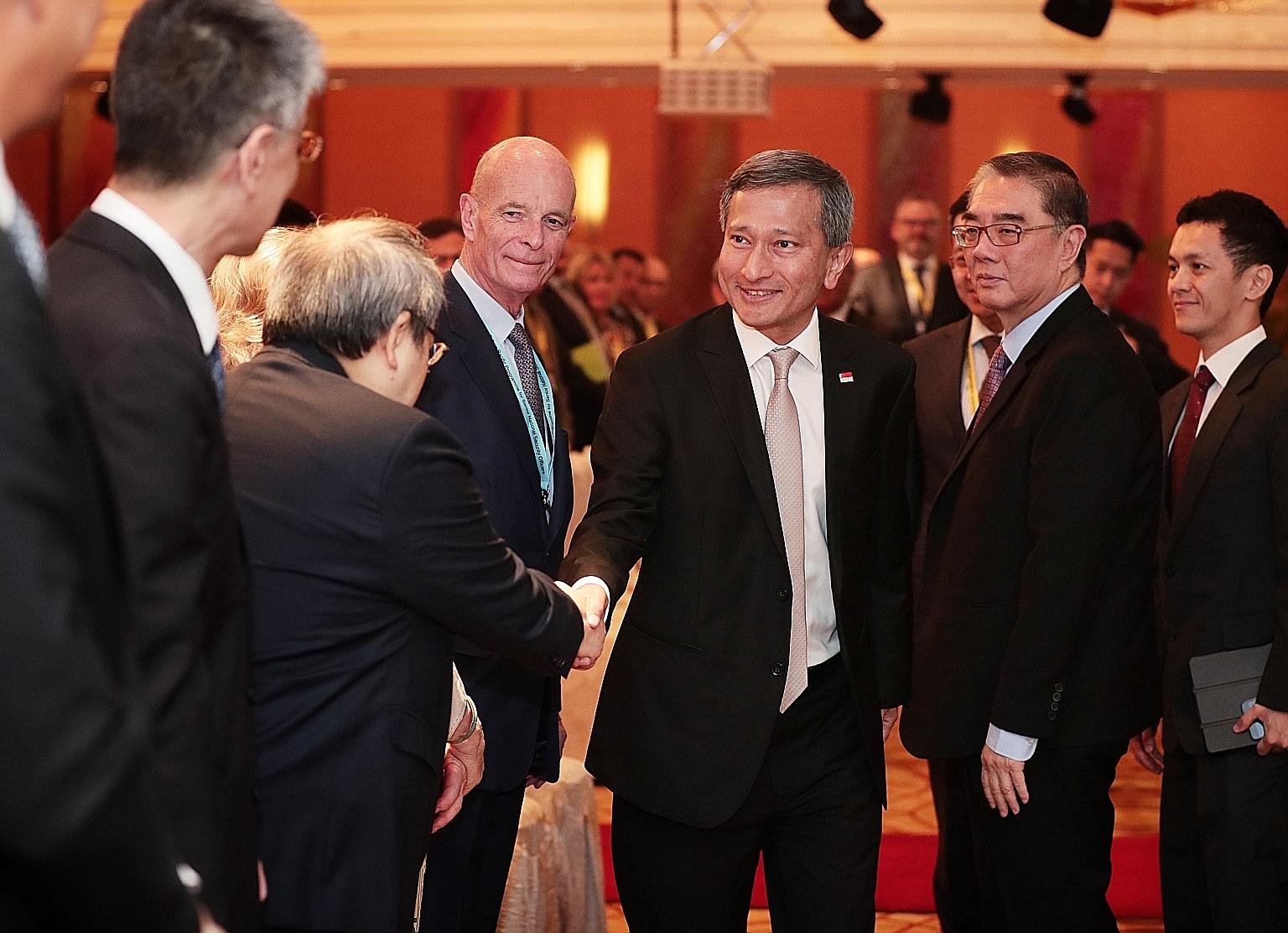 Foreign Minister Vivian Balakrishnan and Ambassador Ong Keng Yong (second from right), executive deputy chairman of the S. Rajaratnam School of International Studies, at the conference yesterday.