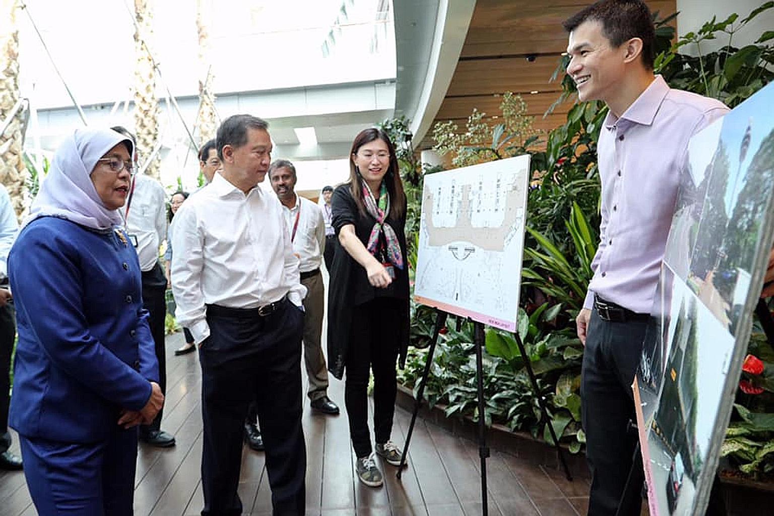 President Halimah Yacob, accompanied by Changi Airport Group (CAG) chairman Liew Mun Leong (in white shirt), visited Jewel Changi Airport yesterday morning, ahead of its official opening next week. While there, she met Ms Lim Peck Hoon, CAG's execut
