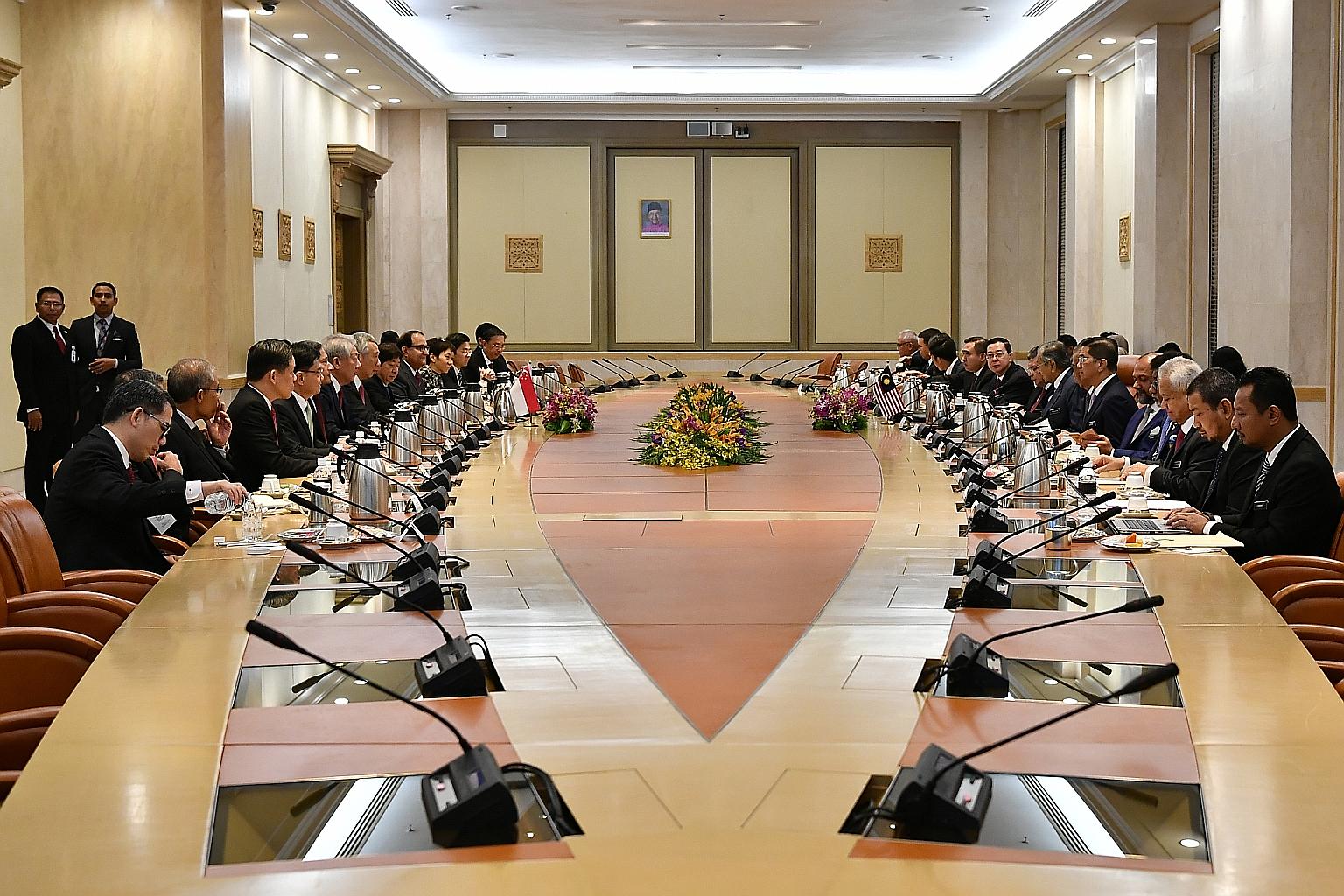 The Singapore and Malaysian delegations meeting at Perdana Putra in Putrajaya yesterday. In a joint statement issued after their Leaders' Retreat, both PMs said historical and cultural links are the foundation for stronger relations.
