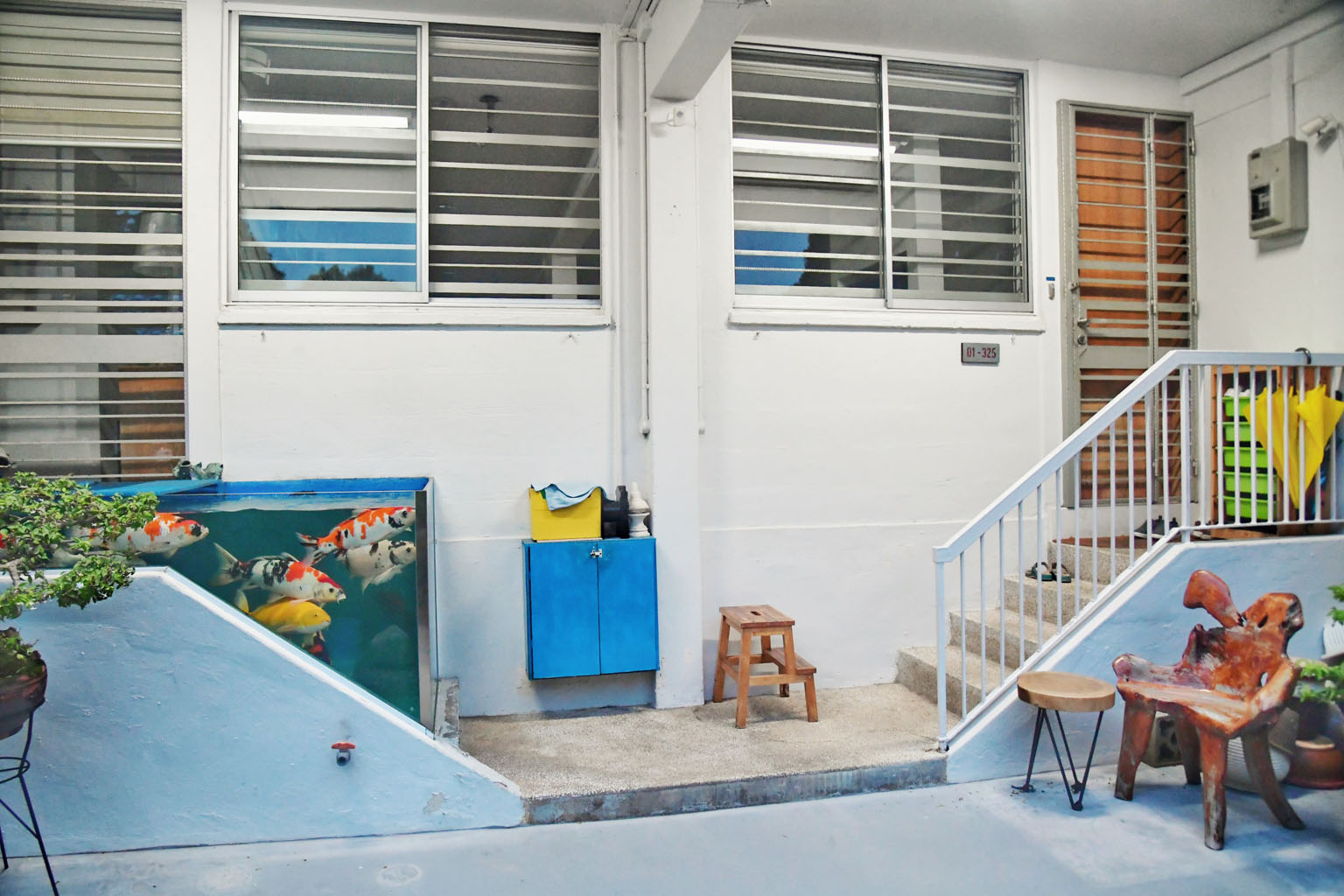 A flat owner who had converted his property's doorstep into a fish tank (above) for his koi carp has failed in his appeal to keep the structure. Tampines GRC MP Baey Yam Keng told ST that HDB and Tampines Town Council are exploring a plan to install