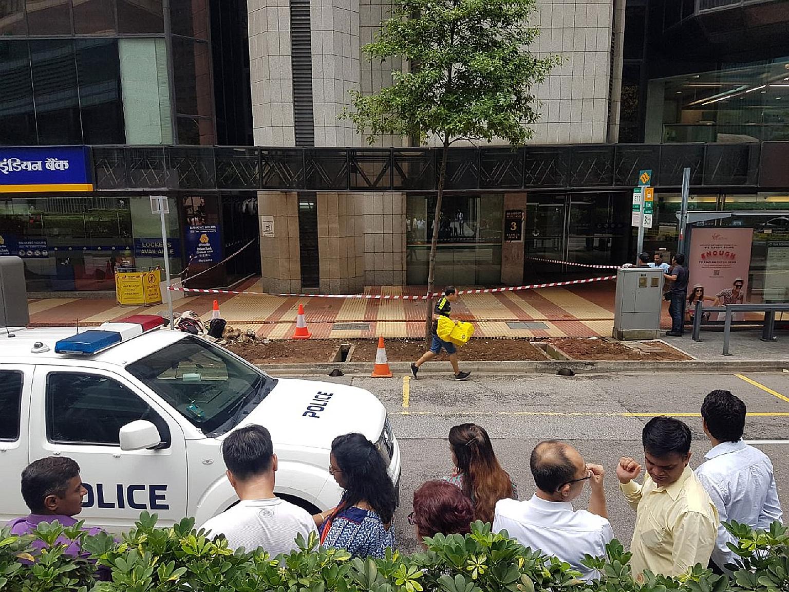 The pieces of stone cladding broke part of the glass canopy at the entrance of Bharat Building. There were no reported injuries, said the Building and Construction Authority, which is investigating the incident.