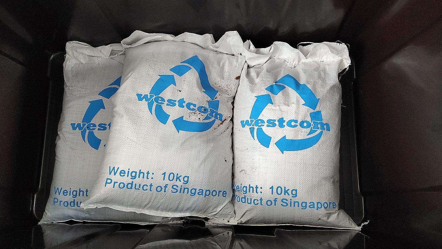 Bags of fertiliser produced by Westcom's food waste recycling machine.