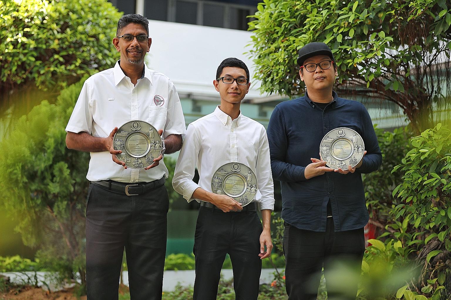(From left) Mr Satesh Kumar A/L Raman, Mr Muhammad Afiq Roslee and Mr Muhammad Zakaria Rosli with their Public Spiritedness Awards at Bedok Police Division headquarters yesterday.