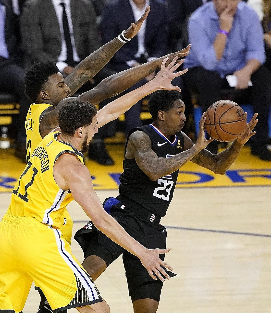 Clippers guard Lou Williams making a pass as Warriors guard Klay Thompson (centre) and forward Jordan Bell defend in Sunday's Game 2 of the NBA Western Conference first-round play-offs in Oakland. The visitors scored 85 points in the second half to b