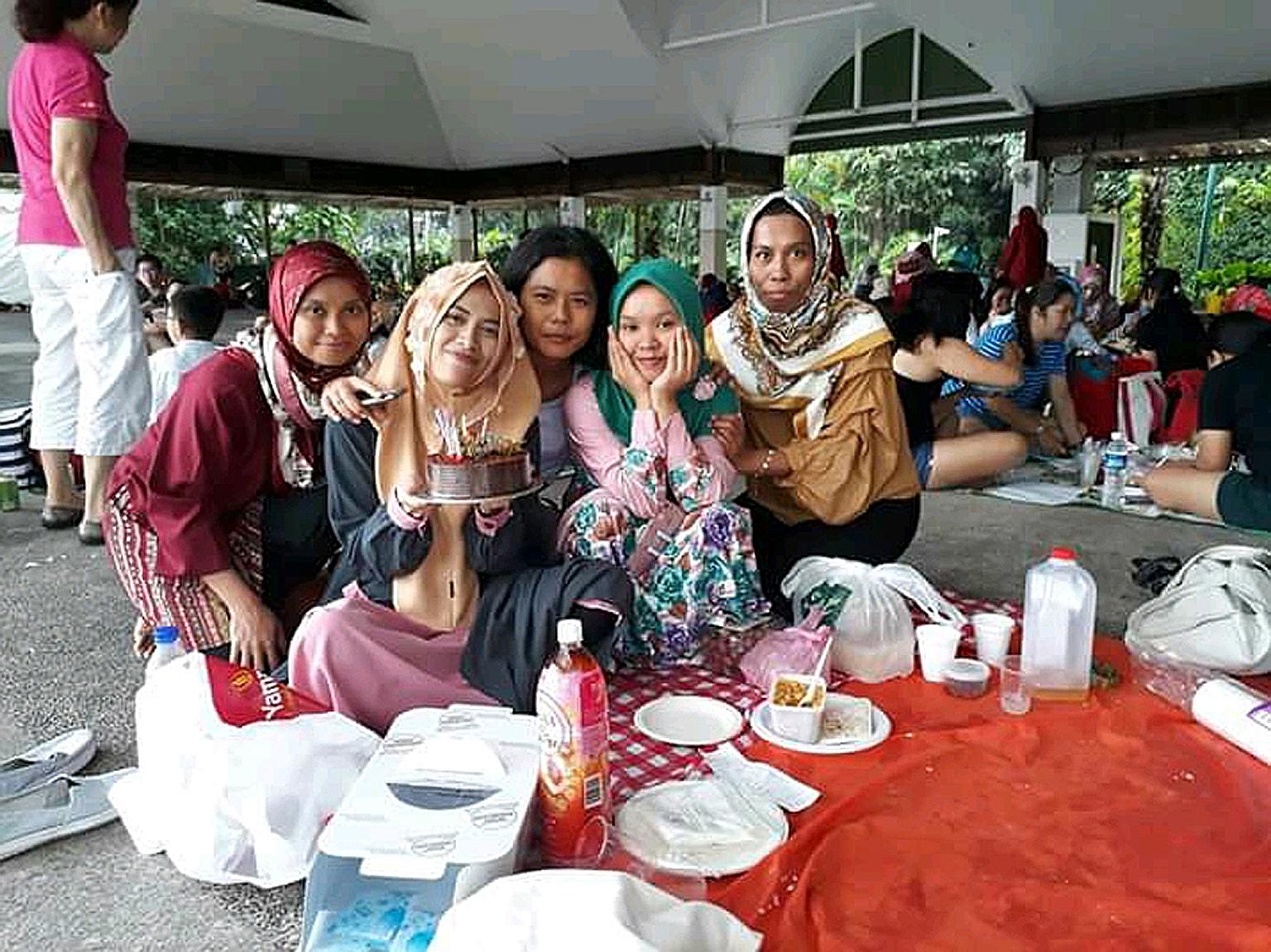 Indonesian maid Ani Sumarni (right), seen here with her cousin Asiah (left), suffered a stroke earlier this month and is now warded at Tan Tock Seng Hospital. Her insurance policy is not enough to cover her hospital bill.