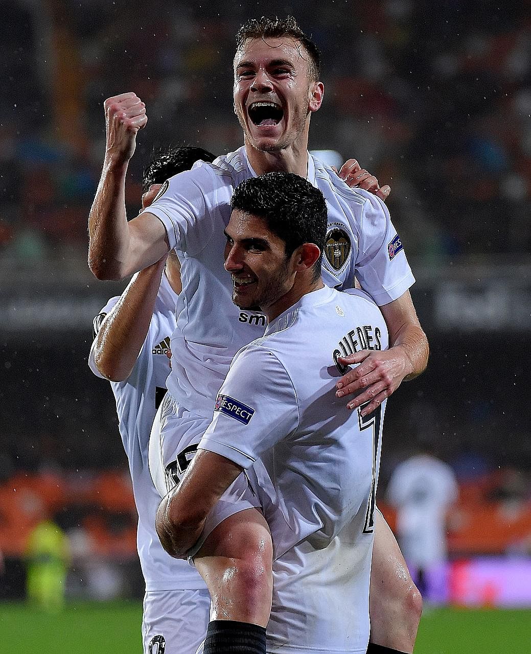 Valencia's Spanish defender Toni Lato celebrating with Portuguese midfielder Goncalo Guedes after putting them in the lead against Villarreal in the Europa League quarter-final second leg at the Mestalla.