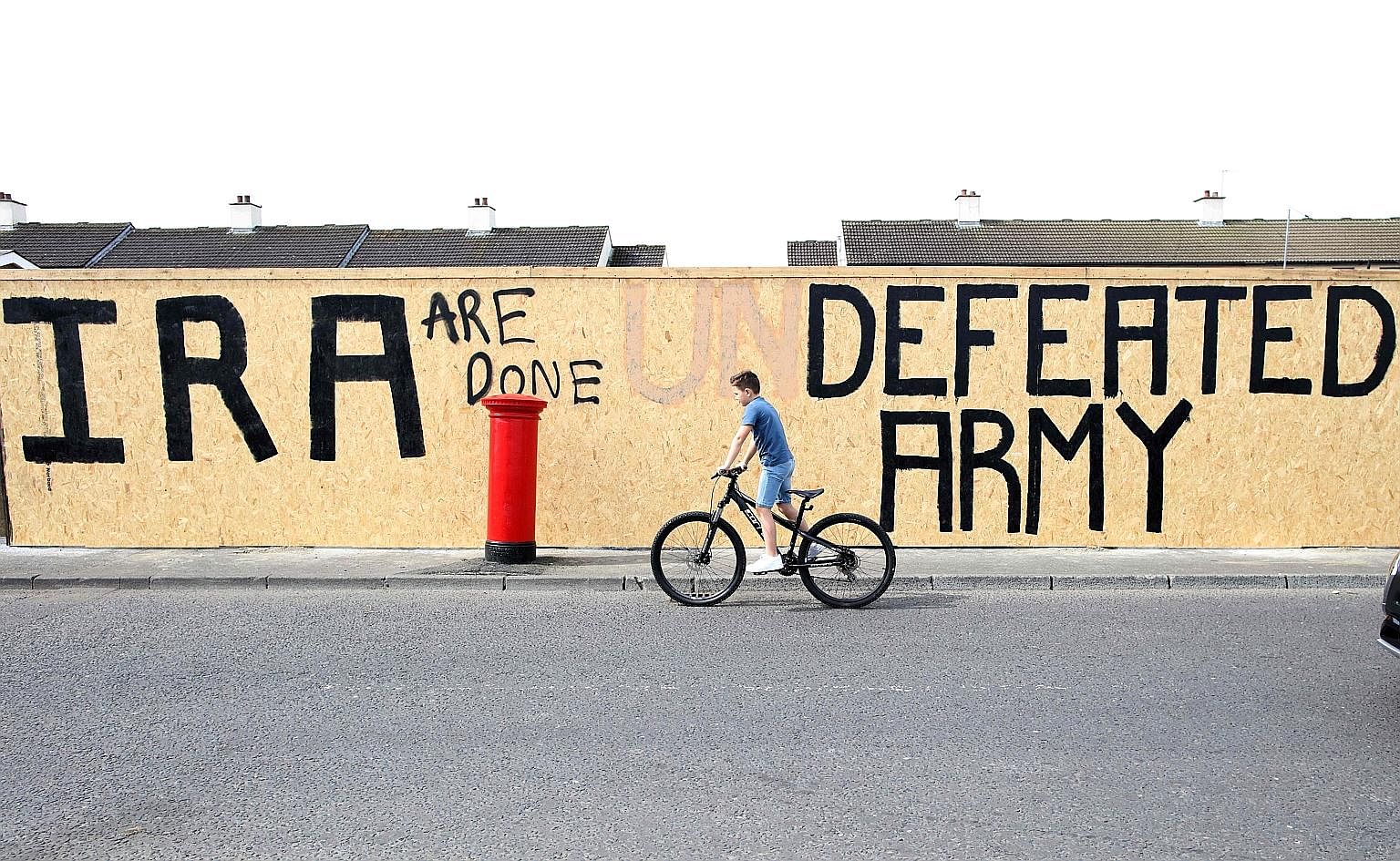 Graffiti that has been amended to "IRA are done. Defeated Army" instead of "IRA undefeated Army" in Londonderry's Creggan area, near where Ms Lyra McKee was shot last week.