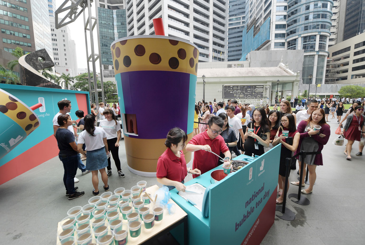 In celebration of National Bubble Tea Day on Tuesday, bubble tea chain Gong Cha and food delivery service Deliveroo joined forces to stage Singapore's biggest bubble tea giveaway at One Raffles Place, where they dispensed free drinks from a 3.5m-tall