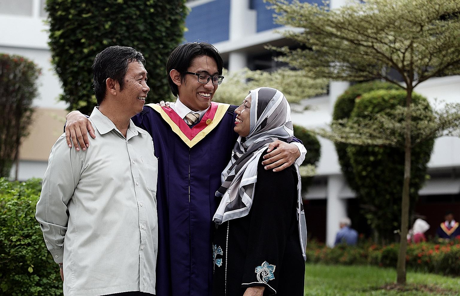 Lee Kuan Yew Award winner Shahreyll Khairoullah with his parents, Mr Khairoullah Shamsurie and Madam Aishah Mohamed, after his graduation ceremony at Nanyang Polytechnic yesterday.