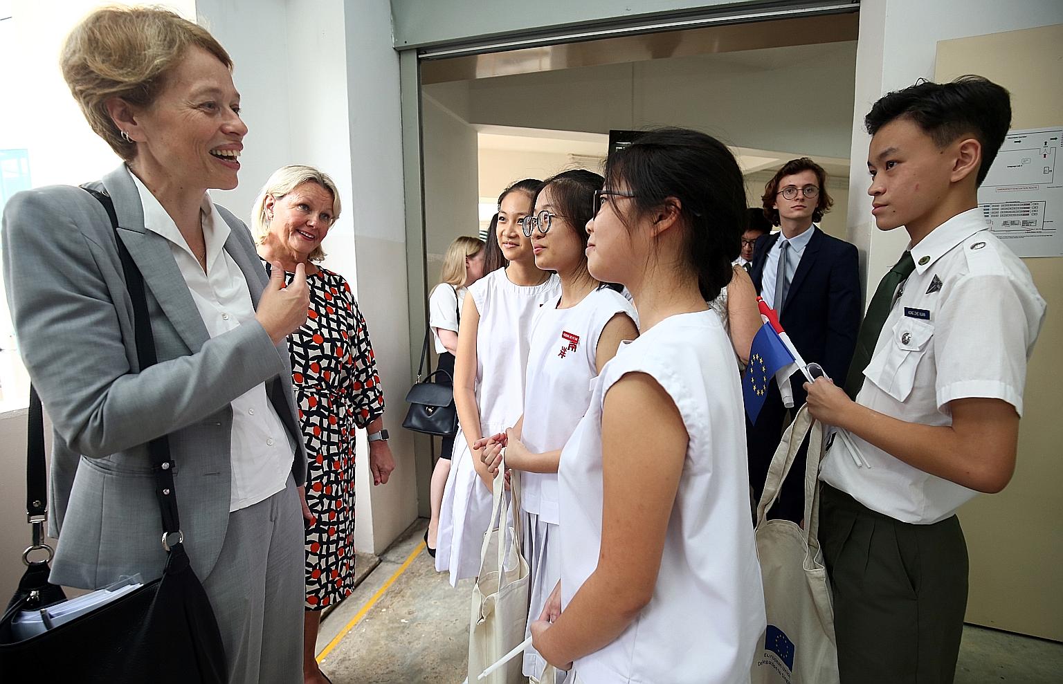 EU Ambassador to Singapore Barbara Plinkert (left) and Finnish Ambassador Paula Parviainen speaking to students after a panel discussion yesterday. European ambassadors will be visiting local schools to give talks on the EU.