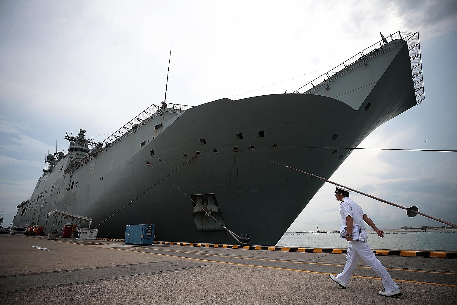 Landing helicopter dock HMAS Canberra, the flagship of the Royal Australian Navy, berthed at RSS Singapura-Changi Naval Base yesterday. The 230m-long ship is making its first appearance in Singapore for the 12th edition of Imdex Asia, a maritime defe