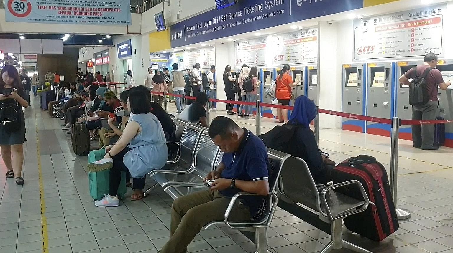 Commuters waiting inside the Larkin bus terminal. Malaysia's Iskandar Regional Development Authority is preparing to roll out a Bus Rapid Transit system to beat congestion and encourage more people to use public transport. ST PHOTO: ARLINA ARSHAD