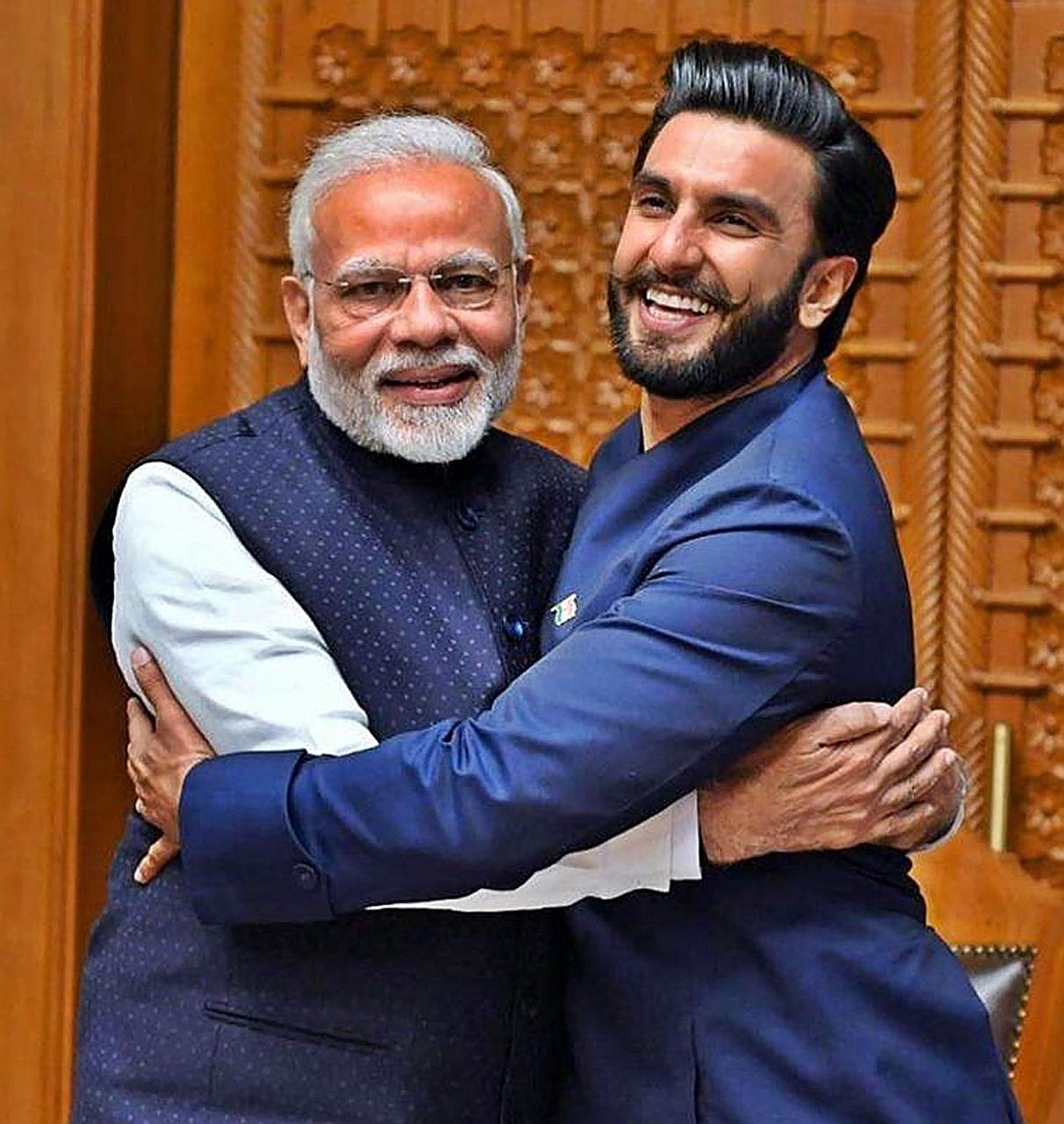 Left: Indian Prime Minister Narendra Modi, seen here with actor Ranveer Singh, has roped in Bollywood stars in his bid for a second term in office. Right: South Korean President Moon Jae-In stroking his pet dog, Tory, in his Seoul residence.
