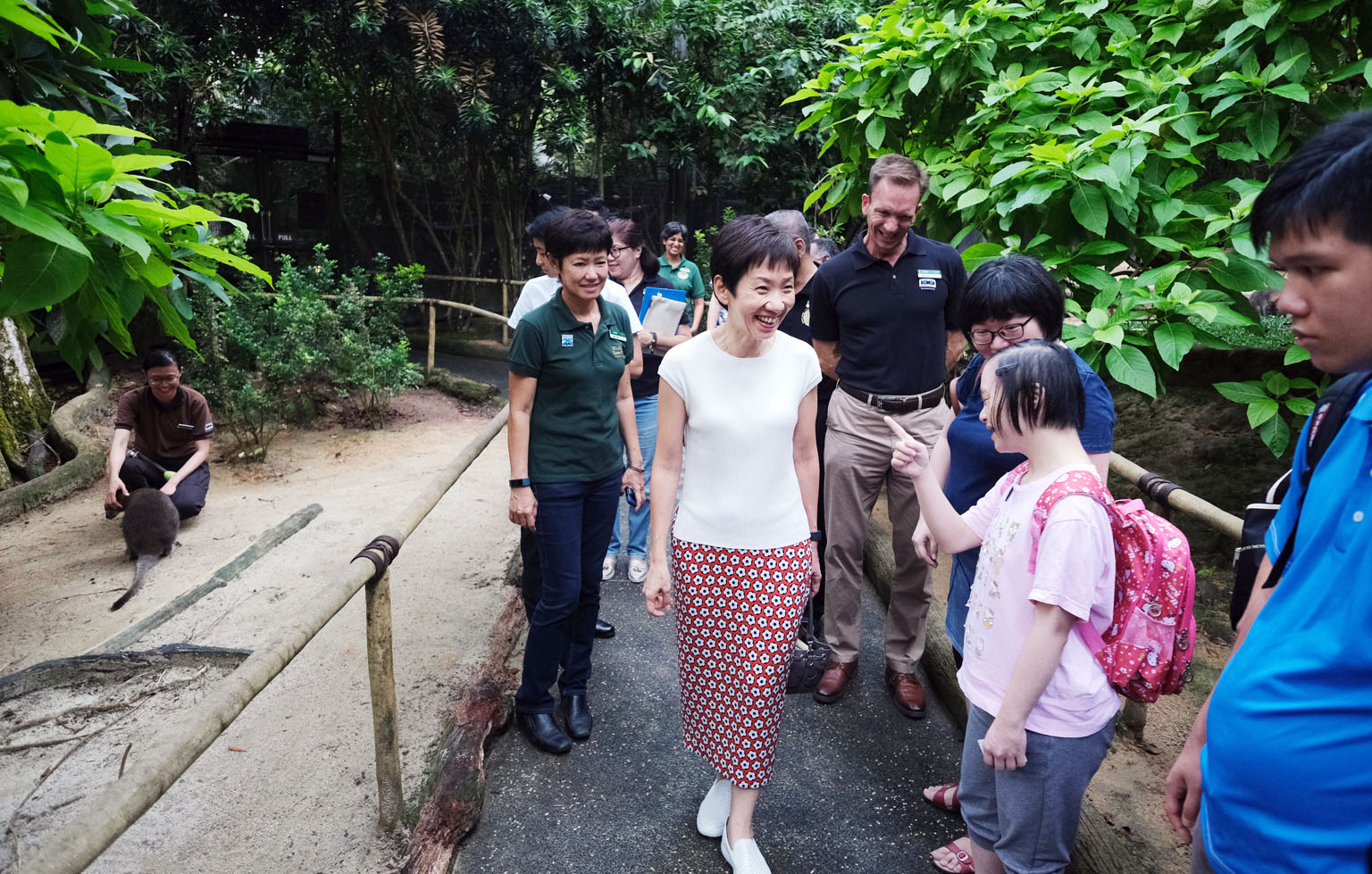 Ms Vivian Wong, 31, a beneficiary of the Movement for the Intellectually Disabled of Singapore, chatting with Minister for Culture, Community and Youth Grace Fu at the Night Safari's wallaby enclosure yesterday. Ms Wong was one of about 50 beneficiar
