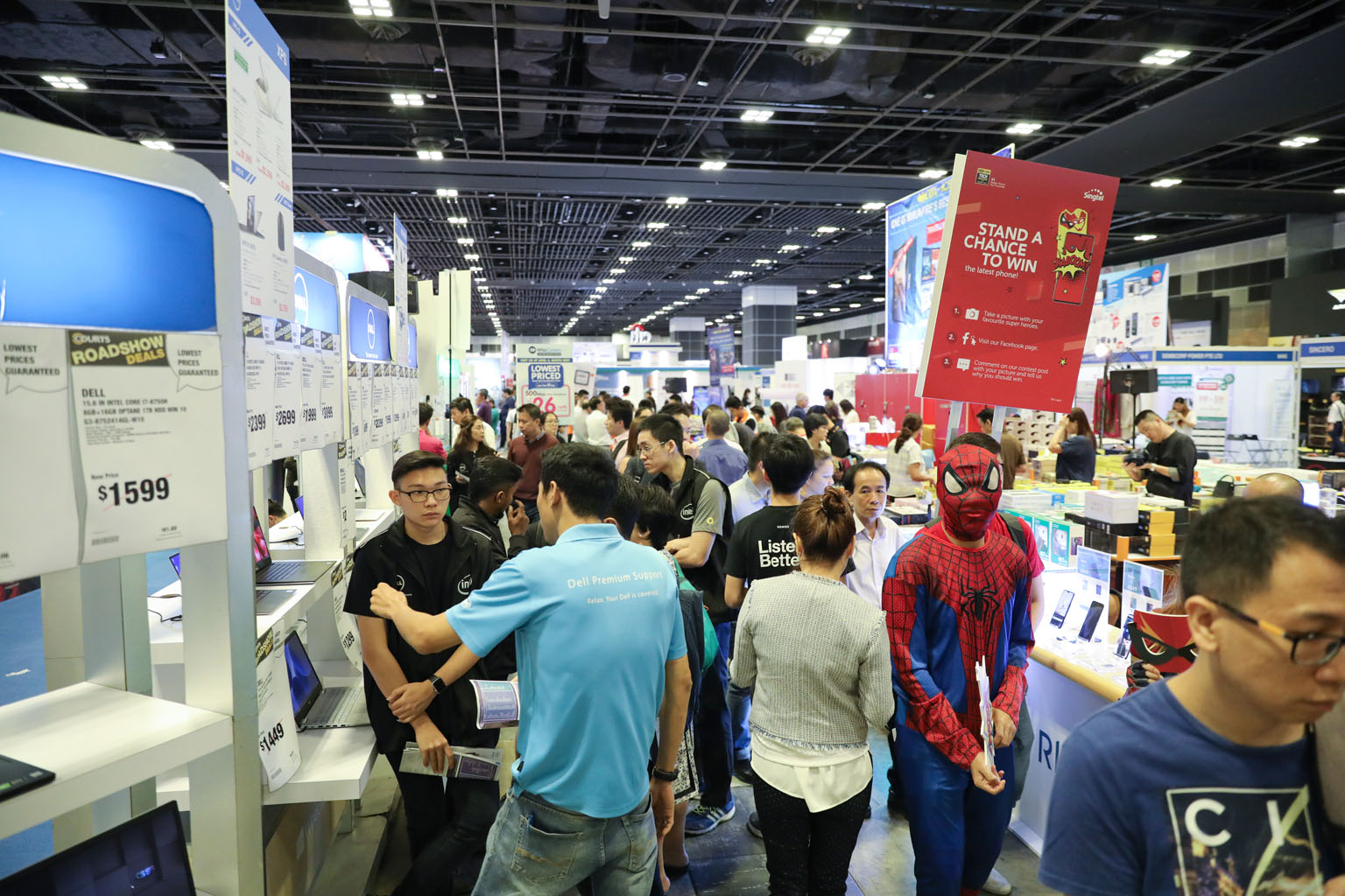 Visitors at the exhibition at the Suntec convention centre yesterday. A gadget trade-in initiative, a regular feature for visitors, has now been extended to corporate customers.