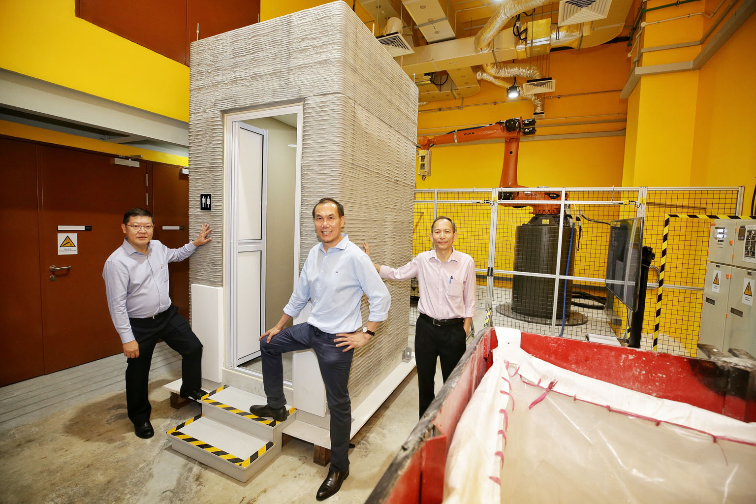 (From left) Mr Lie Liong Tjen from Sembcorp Design and Construction, and Sembcorp Architects & Engineers, with Nanyang Technological University's Associate Professor Tan Ming Jen and Associate Professor Wong Teck Neng.