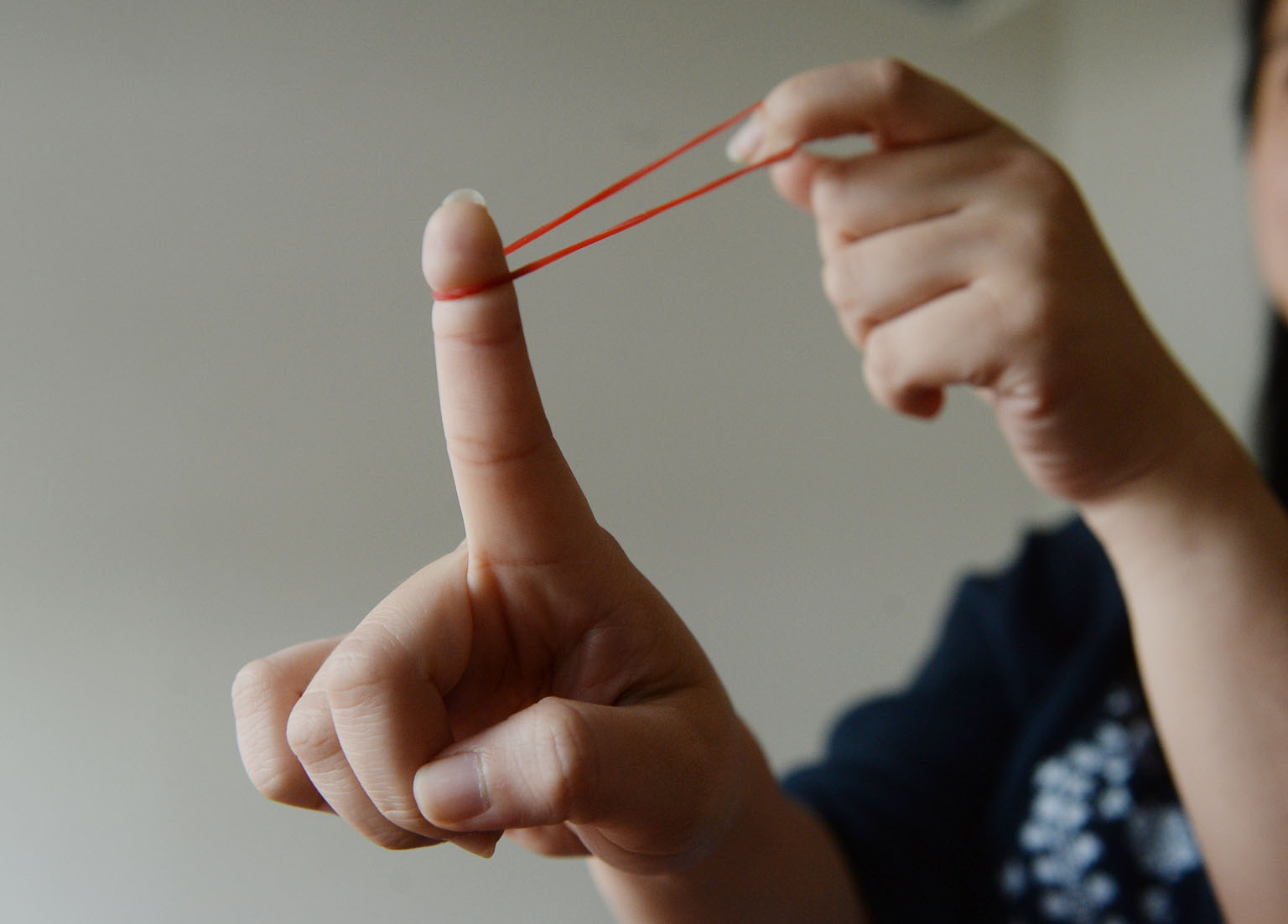 NEA enforcement officers observed the man walking towards his vehicle and shooting two rubber bands, one after the other, which landed on a public road. ST FILE PHOTO