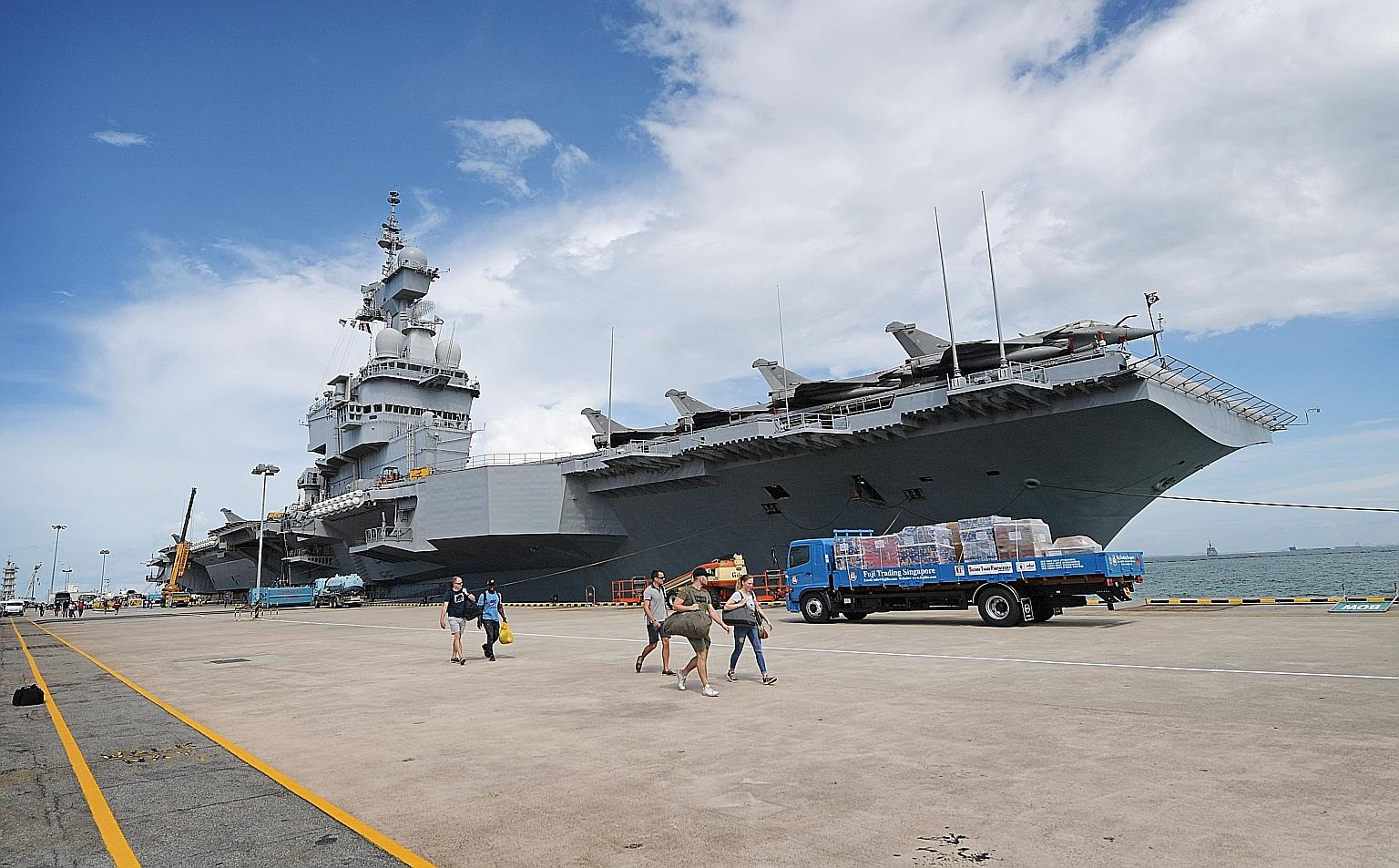 The Charles de Gaulle aircraft carrier at Changi Naval Base yesterday. It will carry out exercises with Singapore's navy and air force next week. ST PHOTO: ALPHONSUS CHERN