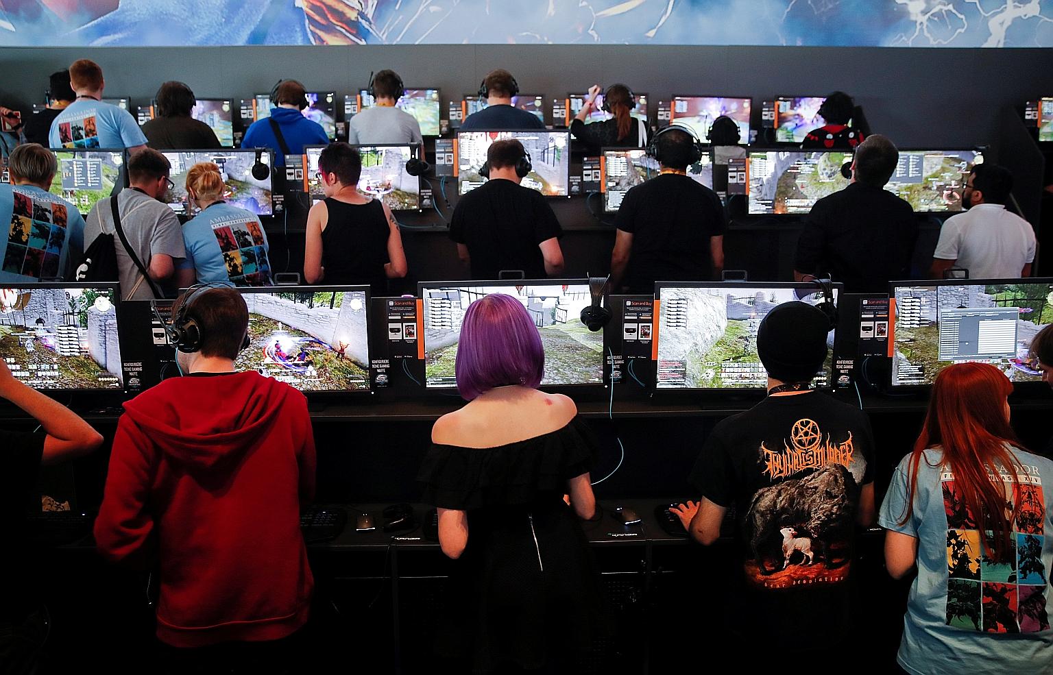 Gamers at the 2017 edition of gamescom in Cologne, Germany. Held there yearly since 2009, the festival is a highlight of the gaming world and the industry's largest event measured by exhibition space and visitor numbers. The Asian edition in Singapor