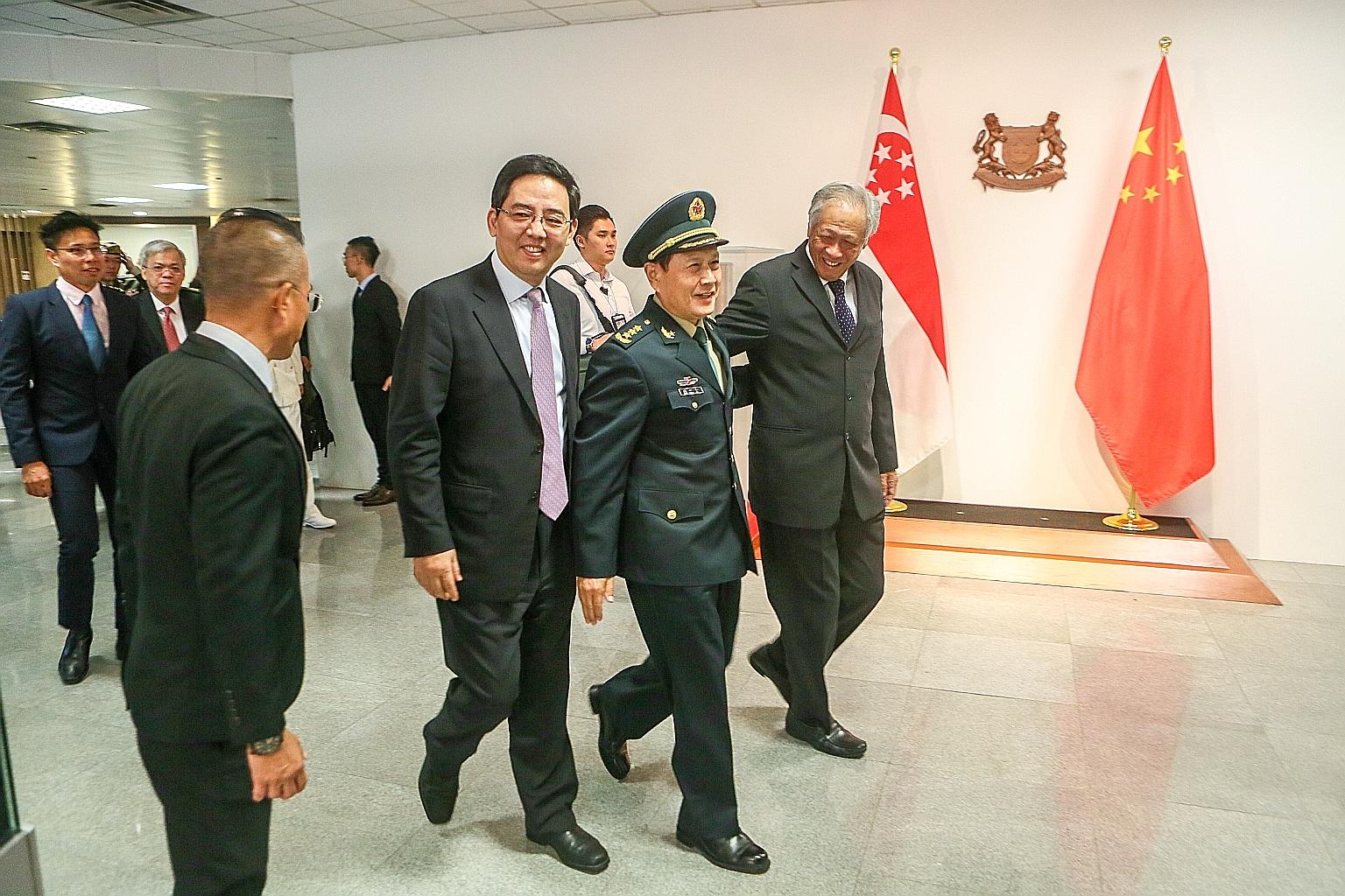 Chinese Defence Minister Wei Fenghe, flanked by his Singapore counterpart Ng Eng Hen (right) and Chinese Ambassador to Singapore Hong Xiaoyong, at the Ministry of Defence yesterday. Both ministers agreed on a substantial programme to deepen defence t