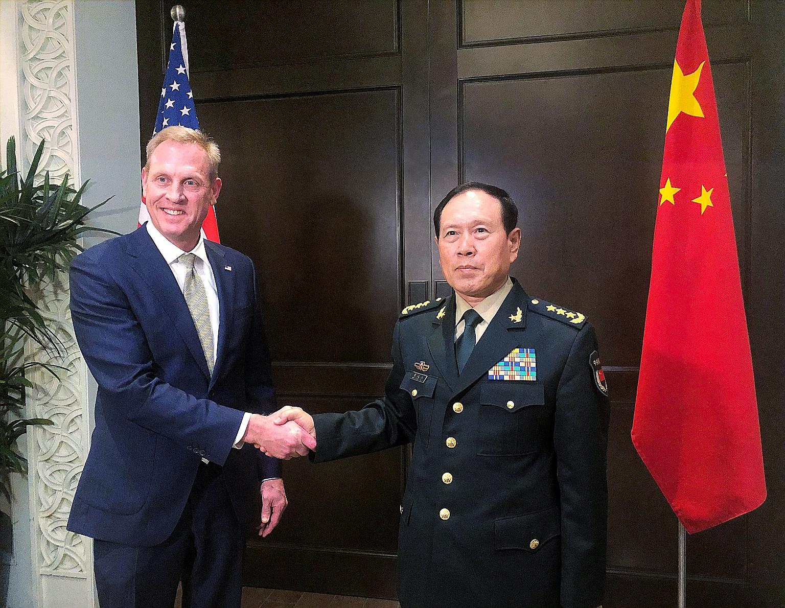 US Acting Defence Secretary Patrick Shanahan and Chinese Defence Minister Wei Fenghe meeting on the sidelines of the Shangri-La Dialogue yesterday.