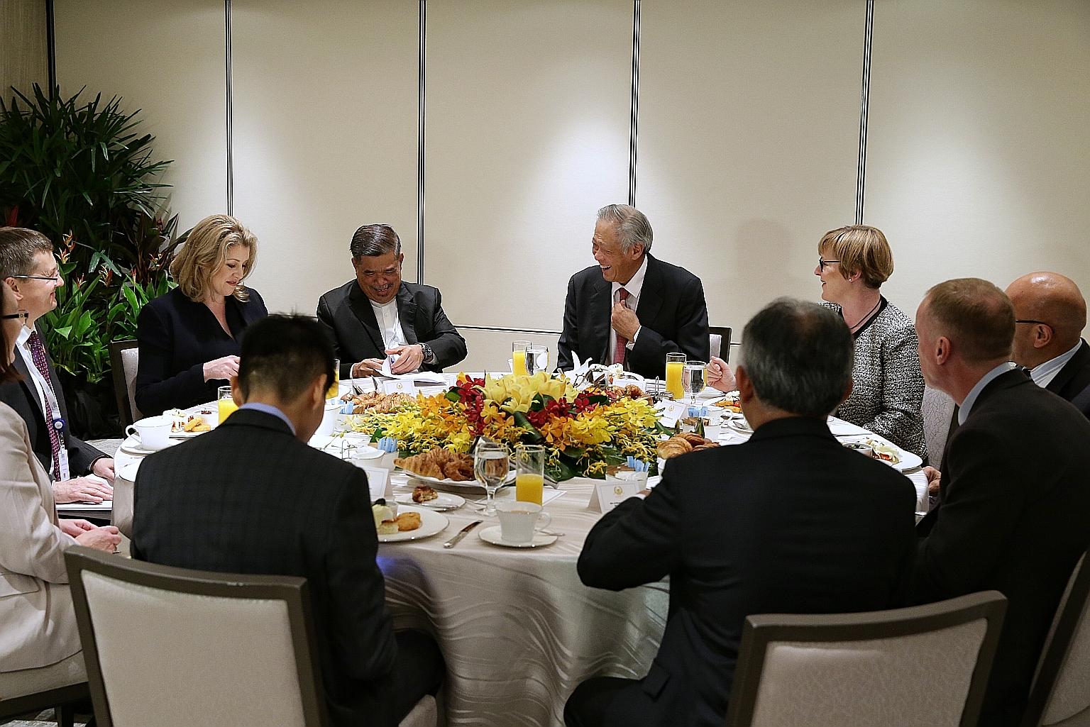 Singapore's Defence Minister Ng Eng Hen (centre) having breakfast with his counterparts from the Five Power Defence Arrangements (FPDA) member nations - (from left) Ms Penny Mordaunt of the United Kingdom, Mr Mohamad Sabu of Malaysia, Ms Linda Reynol