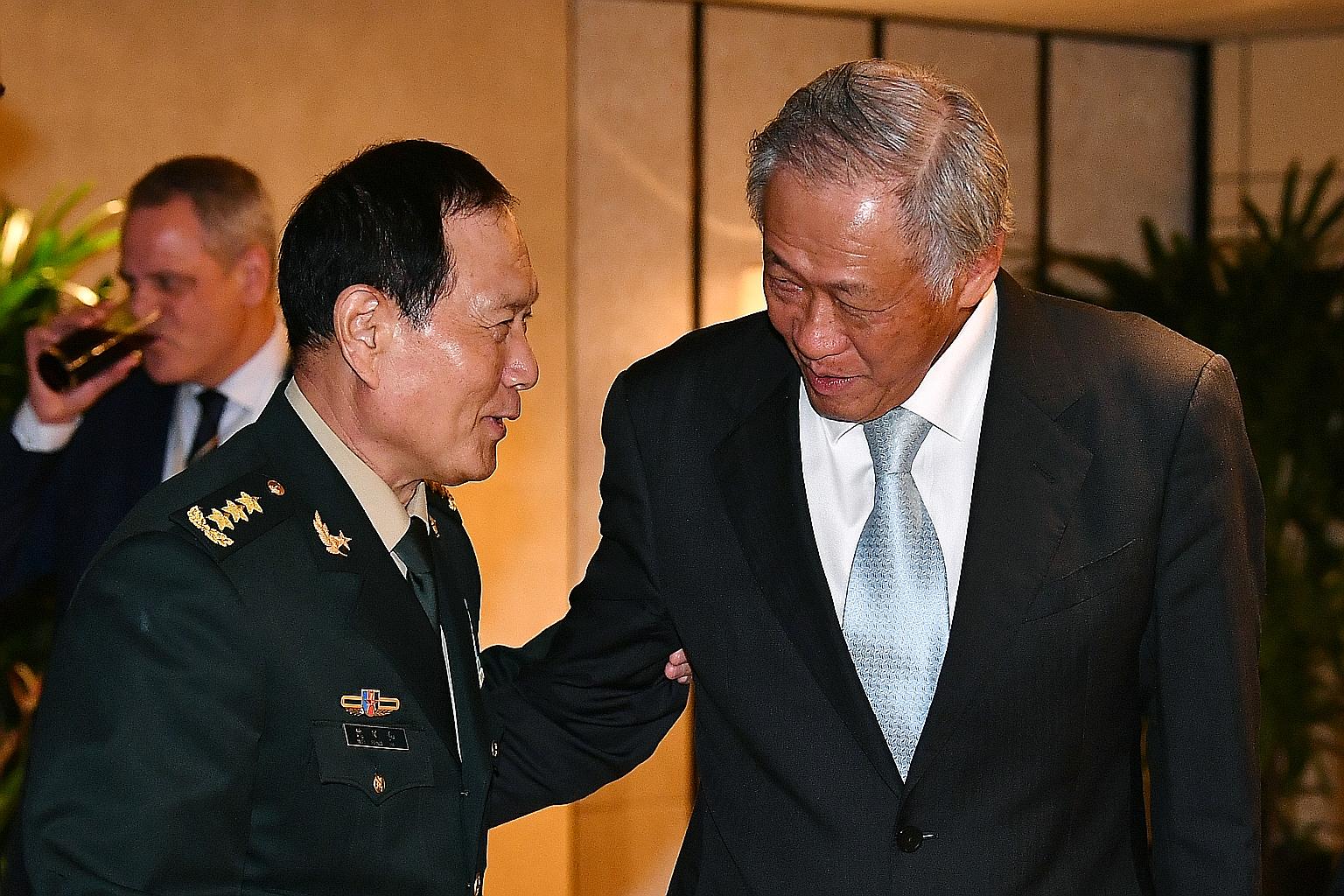 China's Defence Minister Wei Fenghe with Defence Minister Ng Eng Hen during the second ministerial roundtable hosted by Dr Ng at the Shangri-La Dialogue yesterday. ST PHOTO: LIM YAOHUI