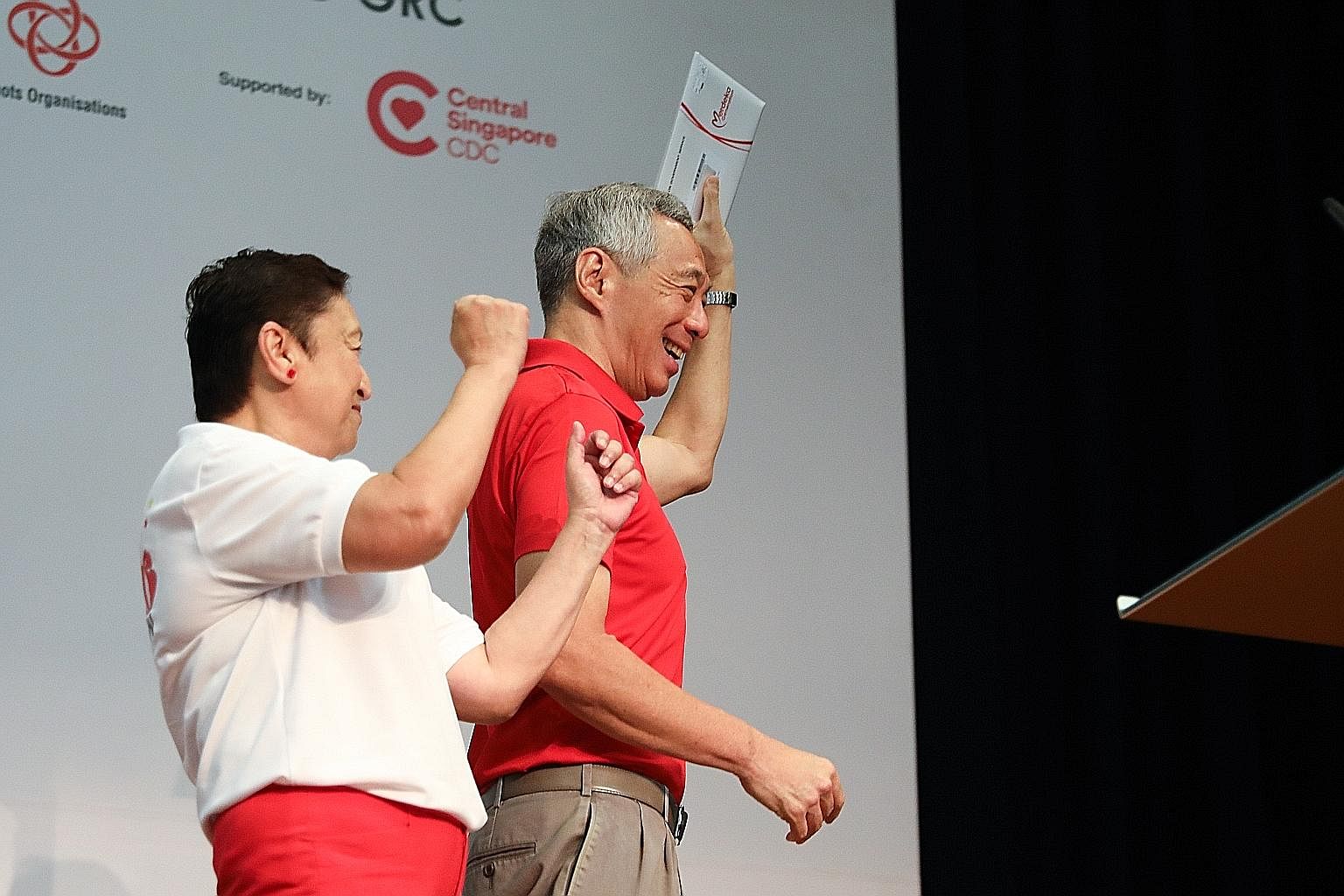 About 8,300 Singaporeans received their Merdeka Generation Package welcome folders yesterday, including Prime Minister Lee Hsien Loong, who was born in 1952. PM Lee received his pack from Madam Noelene De Foe, 66, chairman of the Teck Ghee Community 