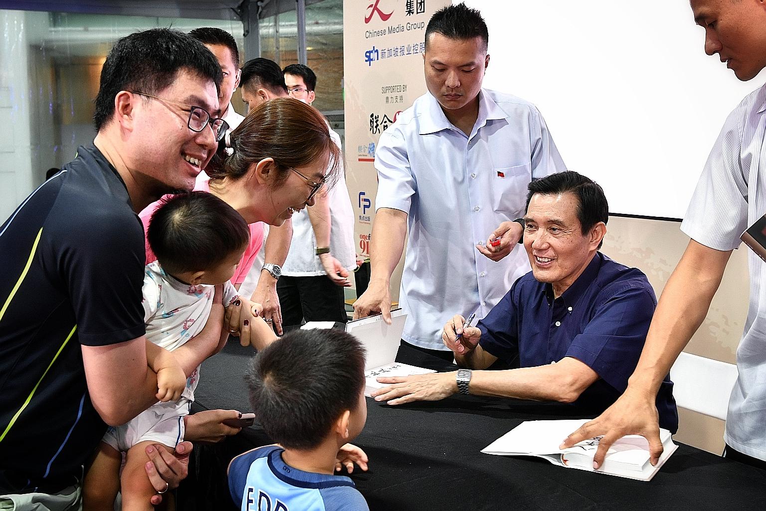 Former president Ma Ying-jeou from Taiwan signing copies of his biography, Memoirs Of My Eight-Year Presidency: 2008 to 2016, at the Singapore Book Fair, at Capitol Singapore, yesterday. The book was a bestseller in Taiwan when it was released last D
