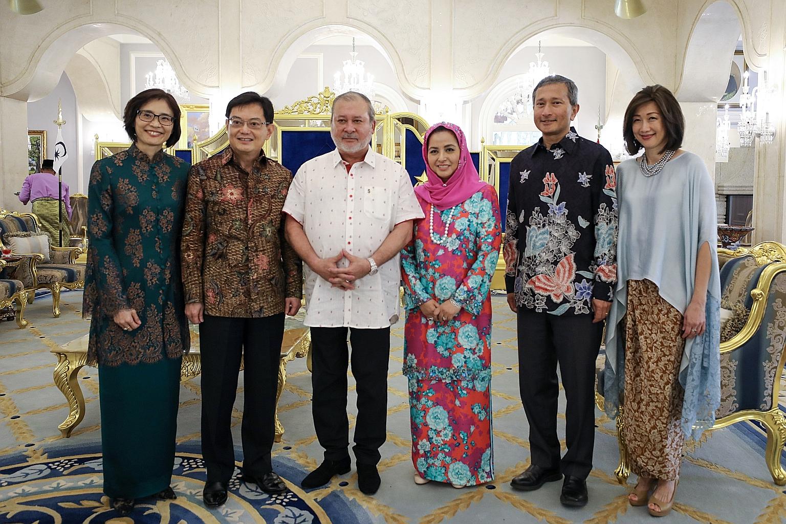 Johor's Sultan Ibrahim Sultan Iskandar and his wife Raja Zarith Sofiah with Deputy Prime Minister Heng Swee Keat and his wife Chang Hwee Nee, and Foreign Minister Vivian Balakrishnan and his wife Joy at the Istana Bukit Serene in Johor Baru yesterday
