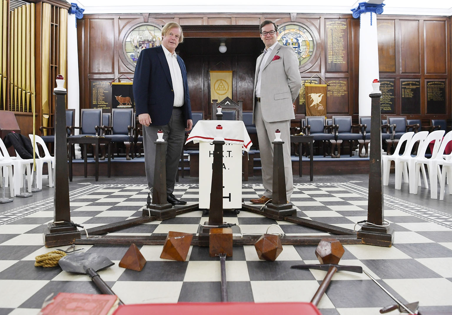 Sir David Wootton (far left), assistant grand master of the United Grand Lodge of England, with its grand secretary, Dr David Staples, in the main temple of the Freemasons' Hall in Singapore yesterday. They are in Singapore for the assembly of the Di