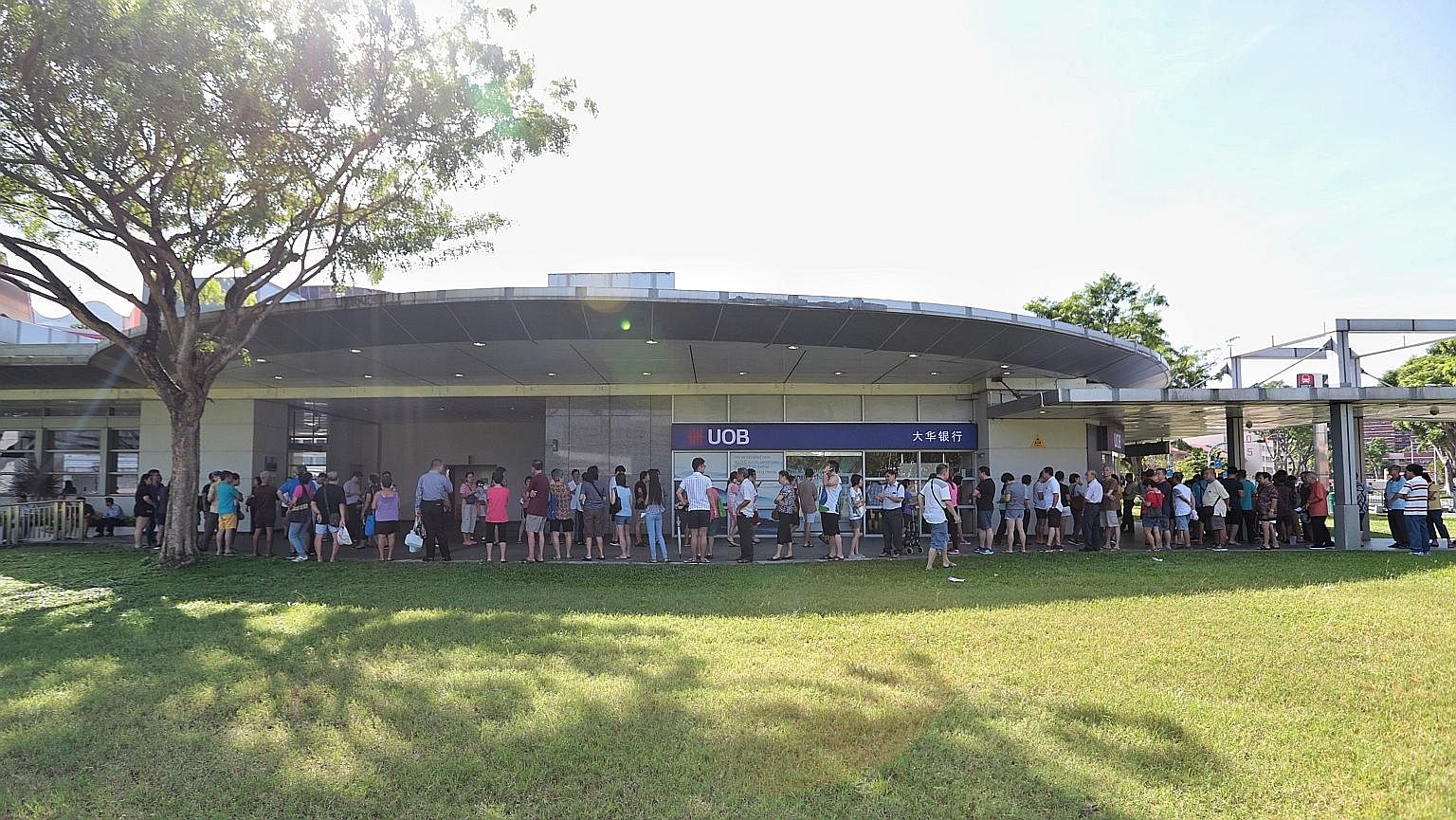 Queues like this one at Hougang Mall formed outside banks yesterday as thousands of people tried to get their hands on a special collector's item. Just what was it that drew these people to wait so patiently? SEE TOP OF THE NEWS A5