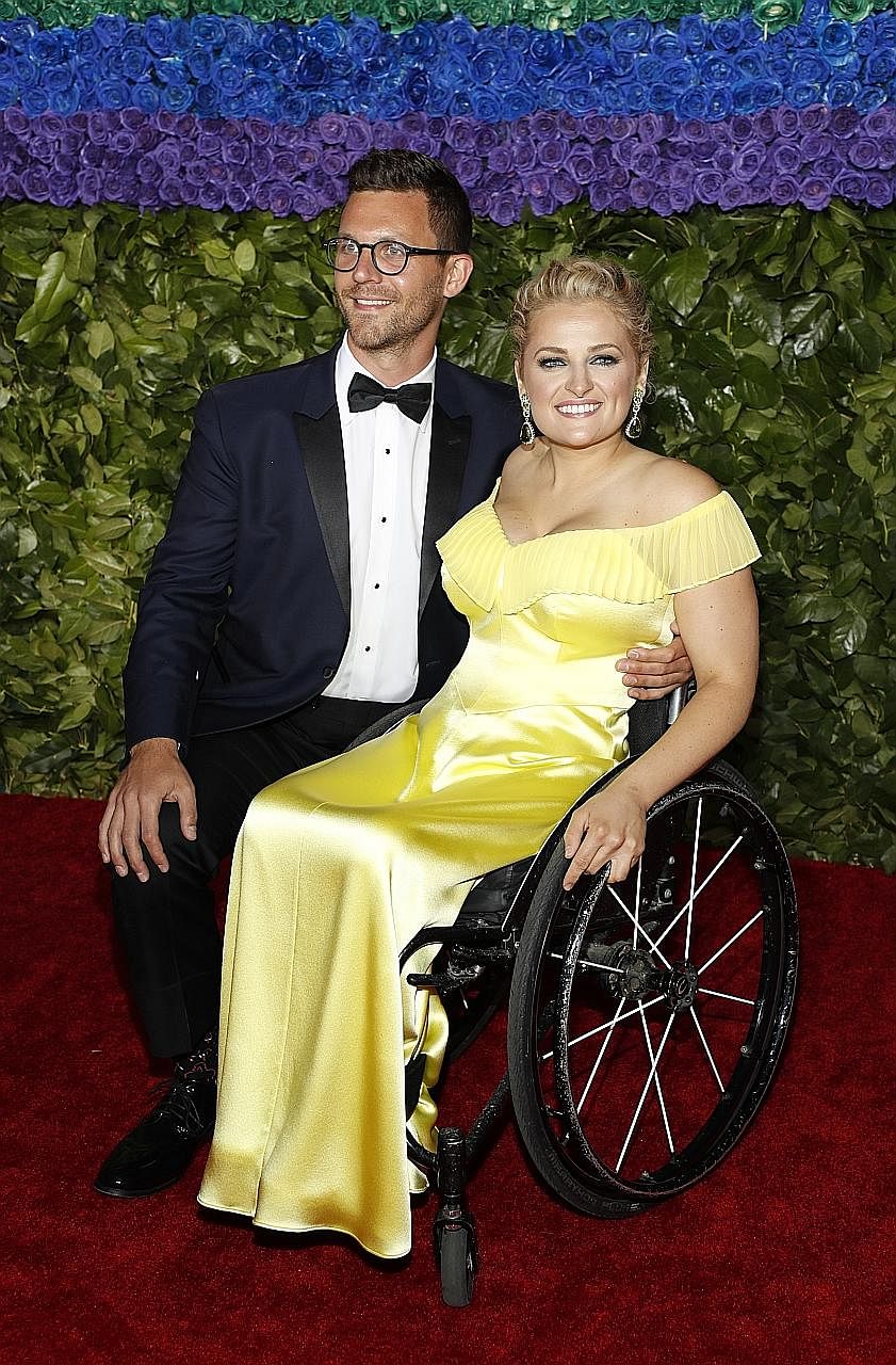 Ali Stroker (above), with boyfriend David Perlow, won the Tony for best supporting actress in a musical for her role as Ado Annie in the revival of Rodgers & Hammerstein's Oklahoma!. Actress Marisa Tomei (right), who was one of the presenters at the 