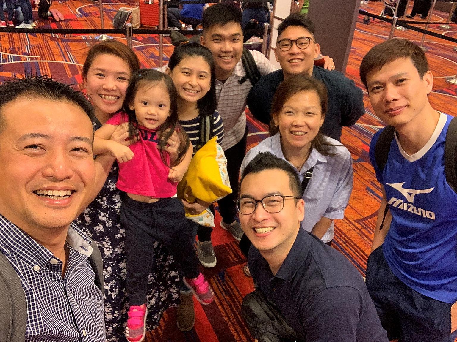 Mr Amos Lim (centre, in checked shirt), a people and organisation development specialist at Emergenetics Caelan & Sage, with his wife Brenna (in striped top) and daughter Celeste, three, at the airport earlier this year before they set off for Dublin