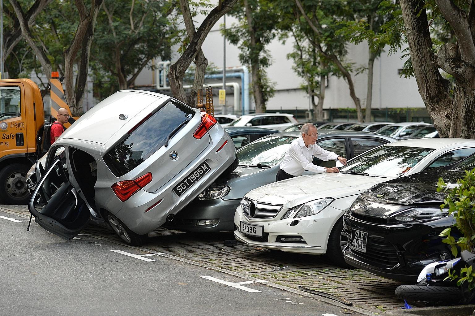A BMW driven by an elderly woman ended up on two other cars in a carpark next to Wheelock Place at about 4pm yesterday. No injury was reported. The Straits Times understands that the Singapore Civil Defence Force deployed two fire bikes, one red rhin