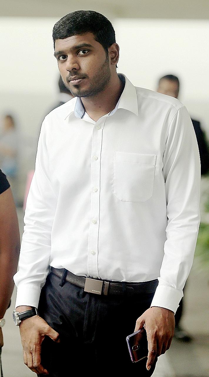 Elvis Xavier Fernandez bought a bundle of whistling fire sparklers and lit them at a housing estate. ST PHOTO: WONG KWAI CHOW