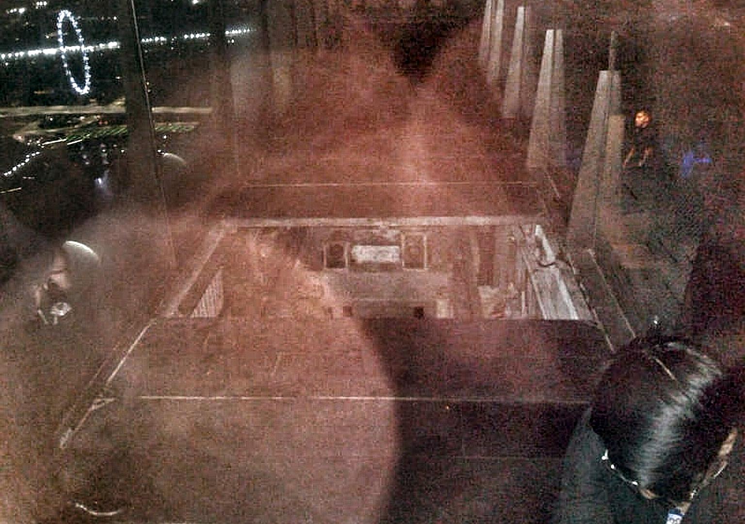 Security guard Shaun Tung (above) fell into a 4m-deep pit near alfresco bar 1-Altitude on the roof of One Raffles Place (left) and died on Sunday. An eyewitness said yesterday that the pit was in an unlit area and there were tables, chairs and a retr