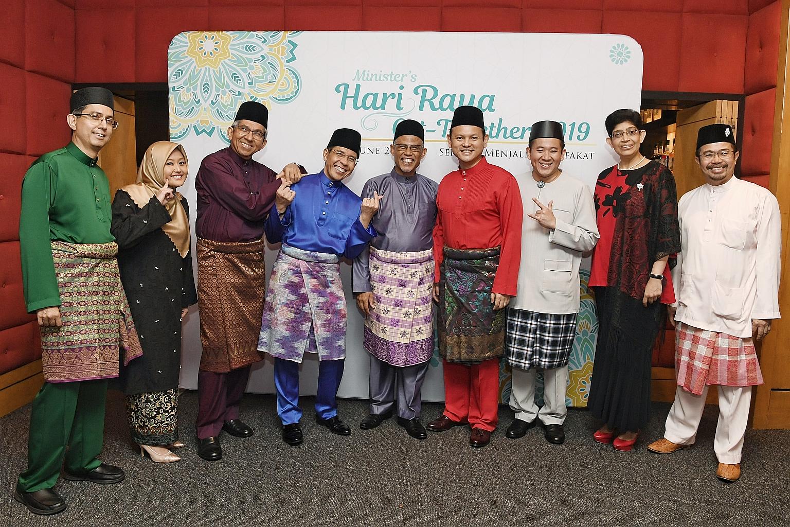 Minister-in-charge of Muslim Affairs Masagos Zulkifli (centre) with (from left) MPs Faishal Ibrahim, Rahayu Mahzam, Yaacob Ibrahim, Maliki Osman, Zaqy Mohamad, Amrin Amin, Fatimah Lateef and Zainal Sapari at a Hari Raya get-together for community and