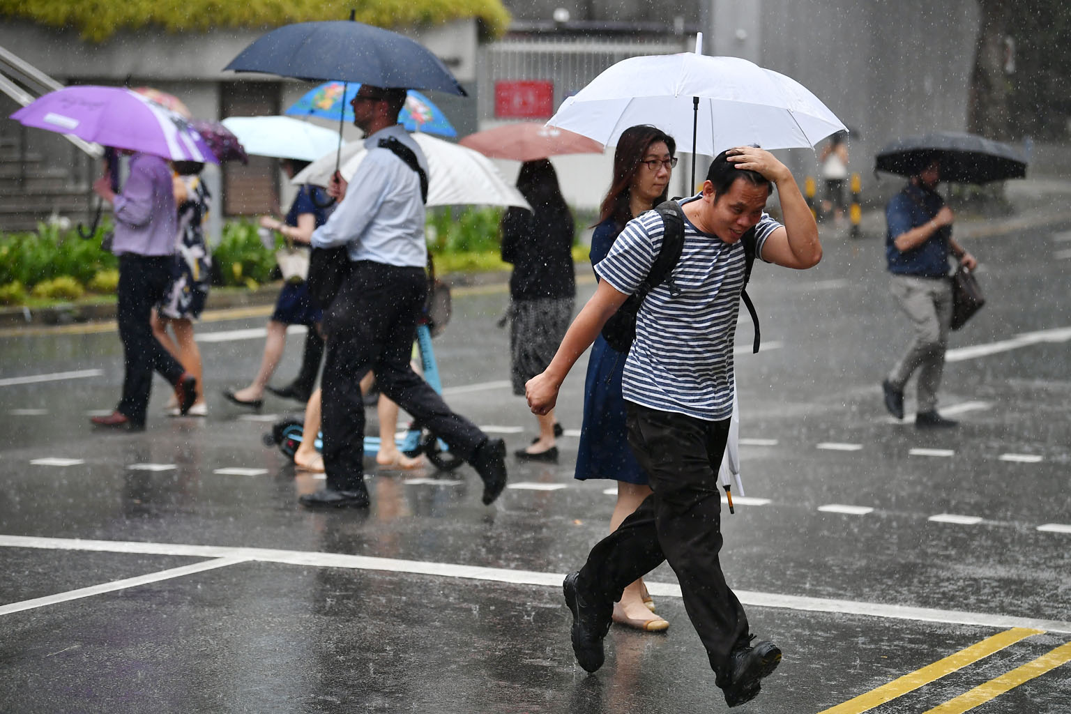 In the second half of this month, showers are forecast to take place mostly in the late morning and in the early afternoon. On some days, the showers are expected to extend into the late afternoon and evening. ST PHOTO: LIM YAOHUI