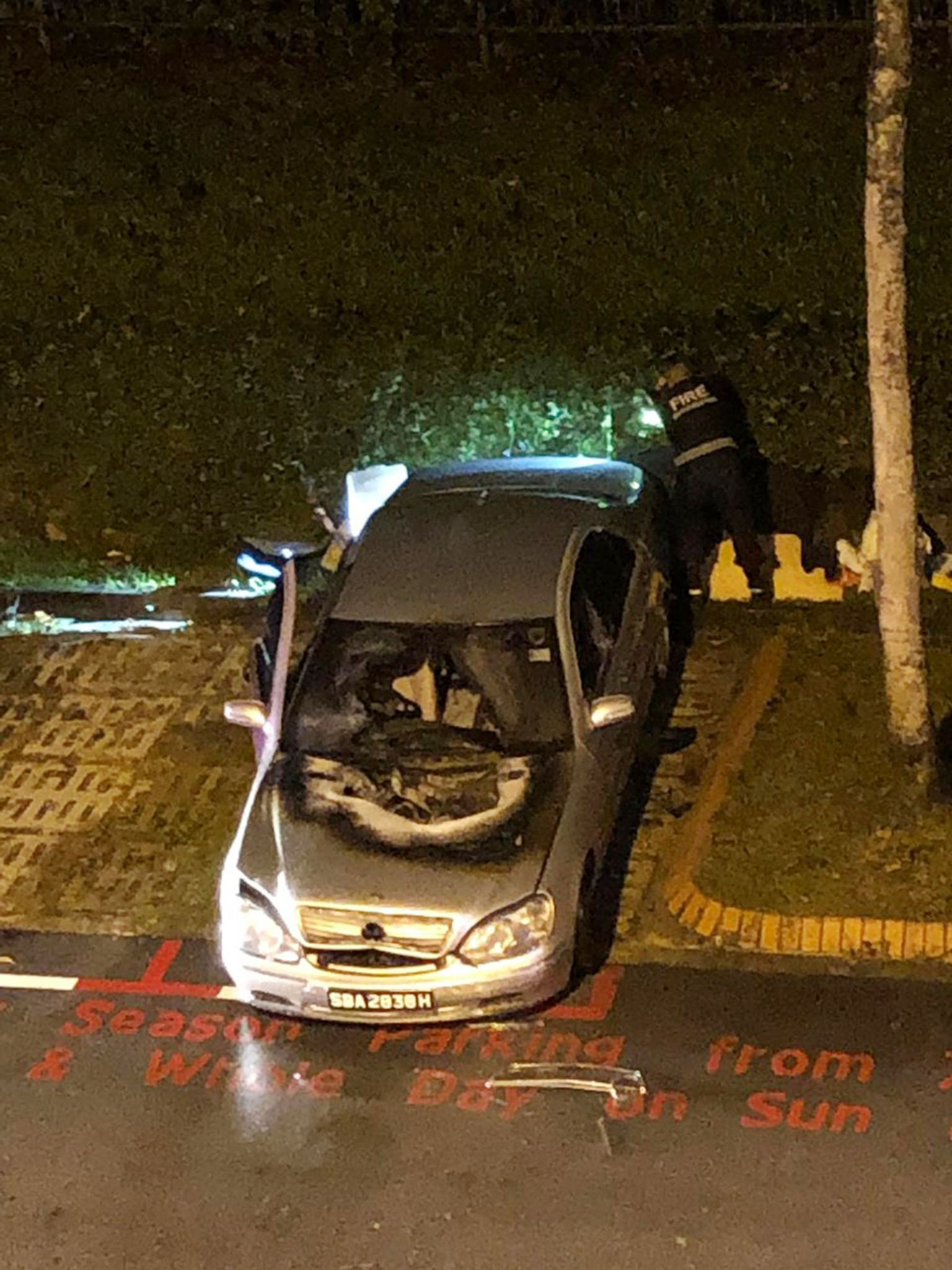 A photo of the aftermath shows the charred bonnet and damaged windscreen of the Mercedes-Benz parked at a Housing Board carpark in Sin Ming Avenue. There were no reported injuries.