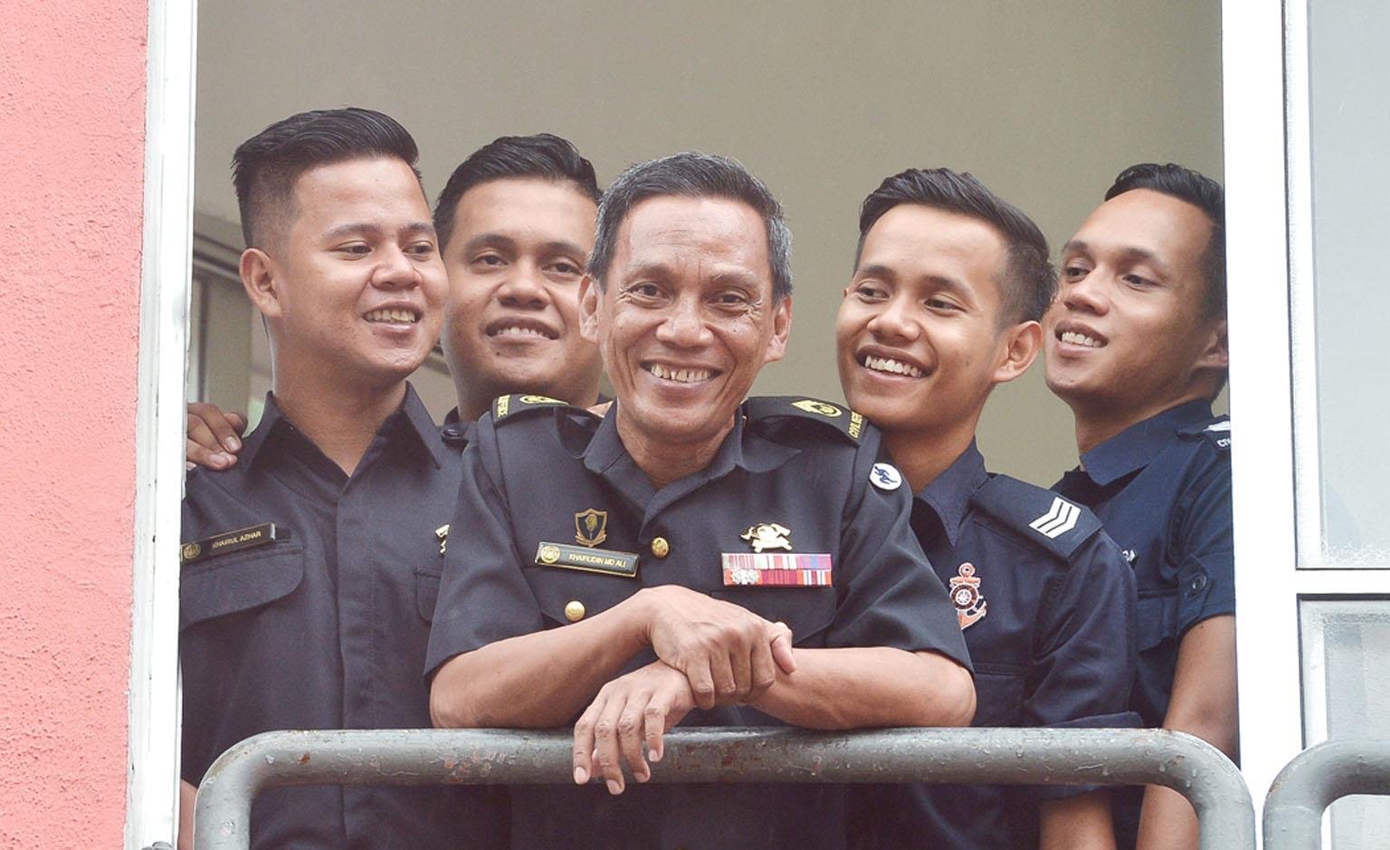 Senior Warrant Officer 1 Khairudin Mohamed Ali with his sons (from left) Khairul Azhar Khairudin, Khairul Anwar Khairudin, Khairul Ariffin Khairudin (in his Police Coast Guard uniform for in-camp training) and Muhammad Khairi Khairudin at Woodlands F