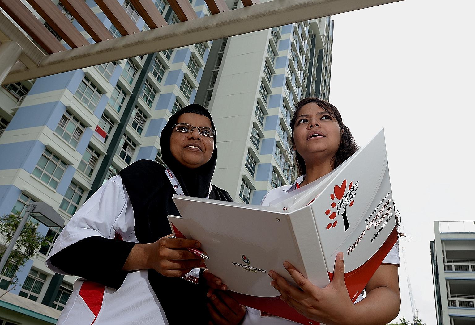 Volunteers Badrun Muneera Mohamed Ali (left) and Nuraeen Basir out to explain the Pioneer Generation Package to beneficiaries in 2015. The package was the result of many Singaporeans' wish for more inclusive healthcare coverage, says Deputy Prime Min
