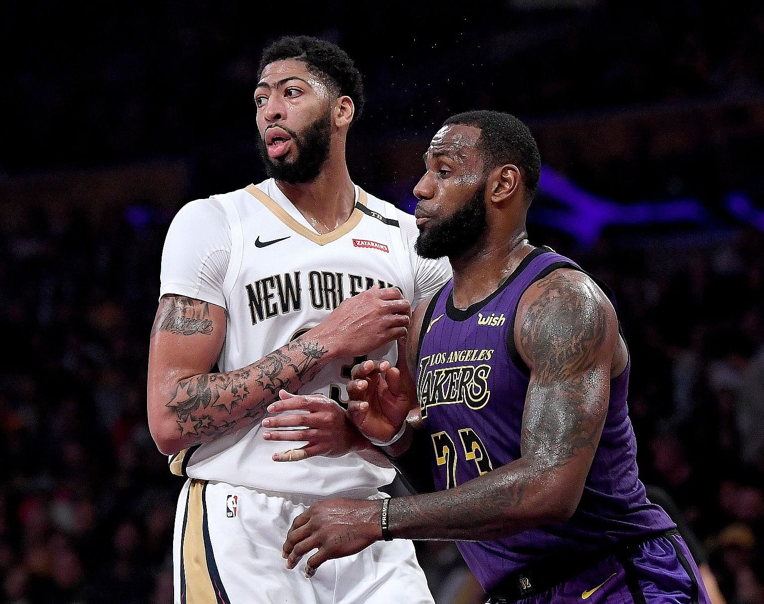 Los Angeles Lakers star LeBron James guarding Anthony Davis during their 112-104 win over the New Orleans Pelicans at the Staples Centre last December. They will play together next season as the Lakers aim to make the play-offs for the first time sin