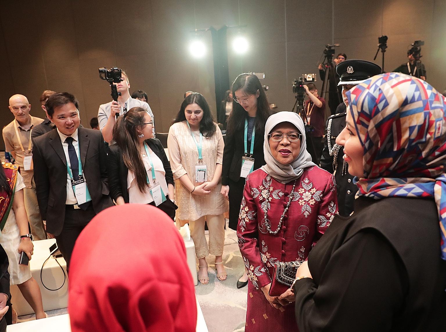 President Halimah Yacob meeting young people working to address challenges of social cohesion in their communities, on the sidelines of the International Conference on Cohesive Societies last night. Around 1,000 academics, government officials and me