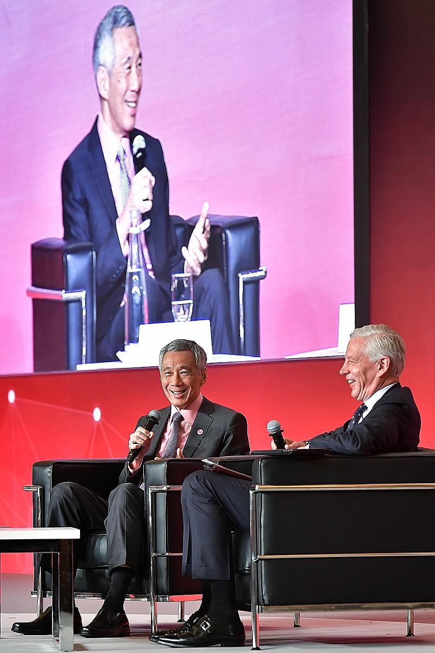 Prime Minister Lee Hsien Loong participating in a dialogue at yesterday's Smart Nation Summit, with moderator Dominic Barton, global managing partner emeritus at McKinsey & Co. In his speech earlier in the day, PM Lee said that while Singapore has a 