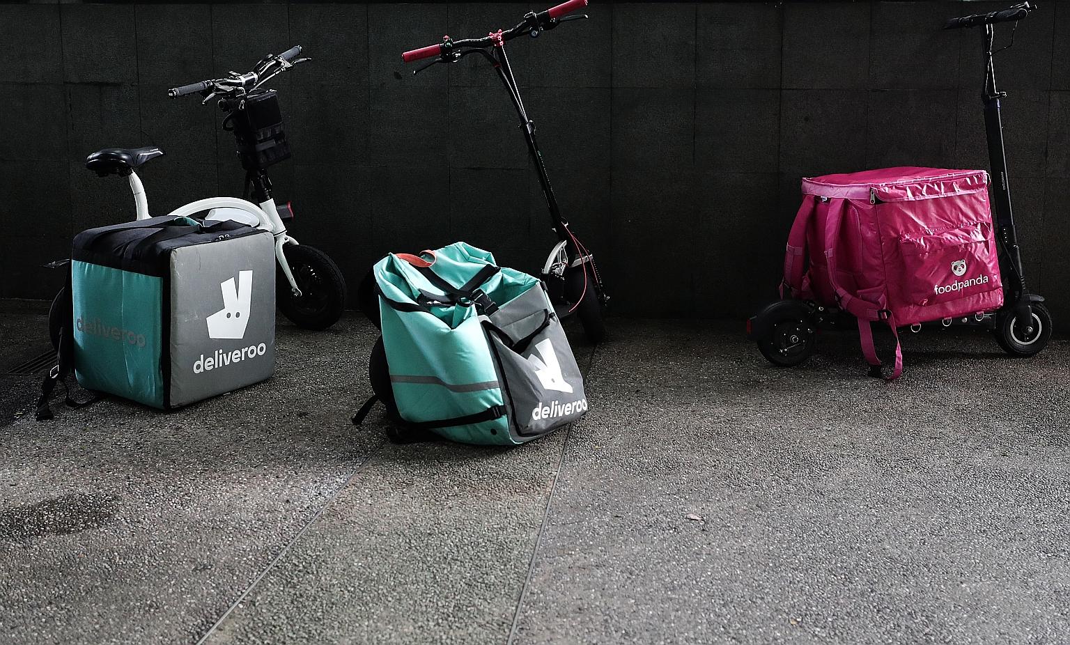 Deliveroo said all 6,000 of its riders have been covered by insurance for free since May last year, while Grab, which runs GrabFood, has also taken up insurance for its riders. ST understands Foodpanda is looking to do the same. ST PHOTO: KELVIN CHNG