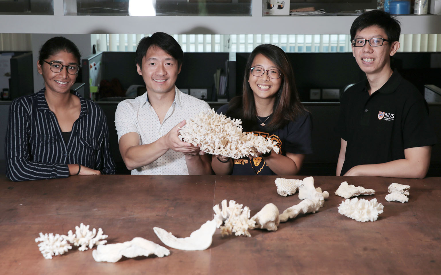 A team of marine biologists from the National University of Singapore, (from left) Ms Sudhanshi Jain, Assistant Professor Huang Danwei, Ms Gwendolyn Chow and Mr Samuel Chan, studied about 3,000 colonies of 124 coral species in the waters around Pulau
