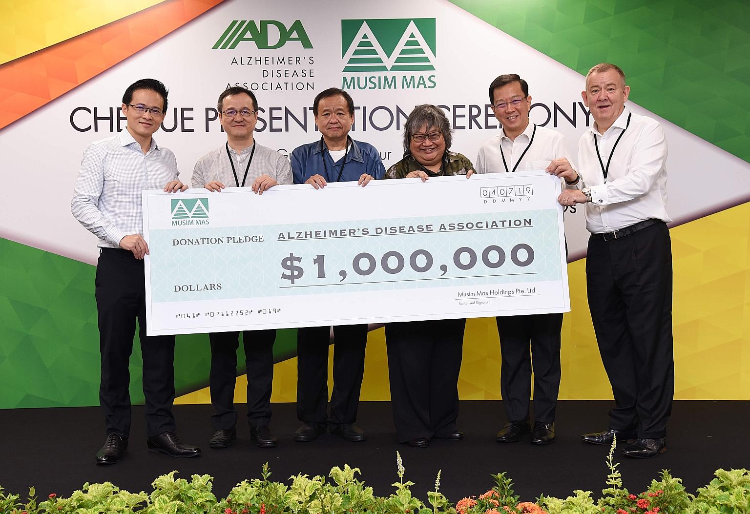 (From left) North East District Mayor Desmond Choo; Musim Mas director and chief financial officer Alvin Lim Ek Tie; Musim Mas director Lim Ek Kian; Alzheimer's Disease Association (ADA) vice-president Ng Li-Ling; ADA chief executive Jason Foo; and M